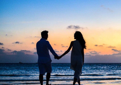 Couple on the beach at sunset