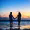 Couple on the beach at sunset